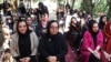 Afghan women attending an event to launch the My Red Line campaign in Herat on August 1.