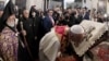 Armenia -- Pope Francis kisses a crucifix as he visits the Apostolic Cathedral in Etchmiadzin, outside Yerevan, June 24, 2016