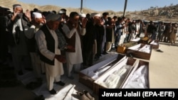 People attend the funeral of victims after a landmine targeted a minibus full of passengers in a Taliban-controlled area of Wardak Province, some 40 kilometers from Kabul, on October 20.