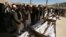 People attend the funeral of victims after a landmine targeted a minibus full of passengers in a Taliban-controlled area of Wardak Province, some 40 kilometers from Kabul, on October 20.