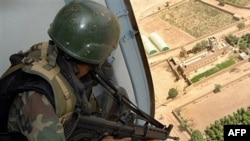 A Yemeni soldier sitting inside a helicopter as it patrols over a rebel stronghold (file photo)