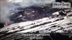 Wideo MH17 ýykylandan soňky pursaty görkezýär