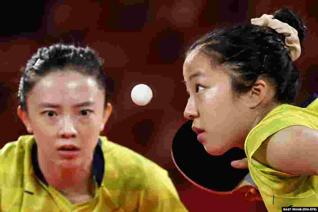 Shin Yubin (R) and Jeon Jihee of South Korea in action against Xiaona Shan and Petrissa Solja of Germany during the Women's Team quarterfinal table tennis match at the Tokyo 2020 Olympic Games at the Tokyo Metropolitan Gymnasium arena in Tokyo, Japan, 03 August 2021.