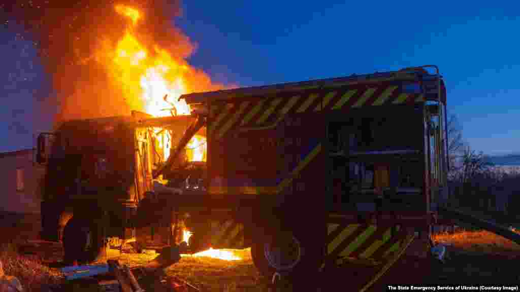The firefighting truck burns after the alleged strike.Ukraine's State Emergency Service said the truck was hit as crews were arriving at the site of a Russian drone strike in Sumy. "At exactly at this moment, when the [firefighting] units were working, the enemy carried out another drone attack," the service said in a statement.