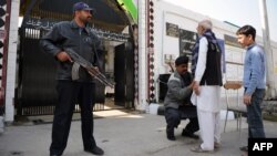 Security measures were already tight ahead of the September 21-22 attacks, including searches as worshipers entered Shi'ite mosques like this one in Islamabad.