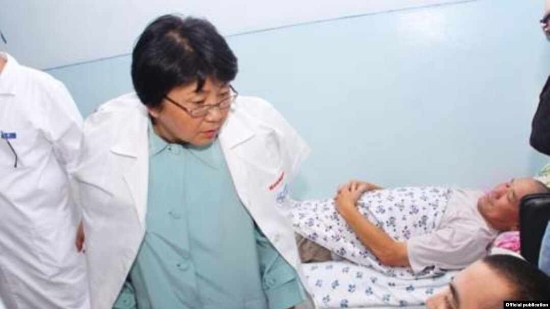 Otunbaeva visiting wounded residents in a hospital in the city of Osh following ethnic clashes in that southern city.