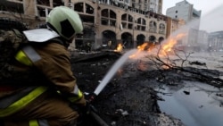 Sirens Wail, A Child Flees For Safety, As Russia Bombs Kyiv 