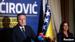 Denis Becirevic accompanied with wife Mirela meet with reporters on October 4.