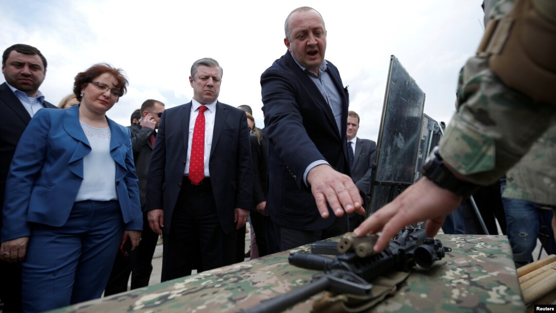 Georgian President Georgi Margvelashvili (right), Prime Minister Georgi Kvirikashvili (center), and Defense Minister Tinatin Khidasheli examine military gear during the opening of the U.S.-led joint military exercise Noble Partner 2016 in Vaziani, Georgia, in May.