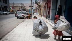 Iran street children forced to do hard work or used for begging.