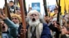 Supporters of the Iran-backed Houthi movement brandish their weapons as they rally in the Yemeni capital, Sanaa, in solidarity with Iran and Lebanon amid the Middle East conflict. (file photo)