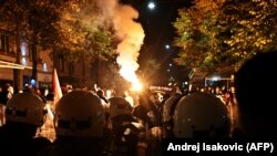 Serbian police units stand in front of far-right groups during a protest against the Miredita, Dobar Dan! festival on October 22.