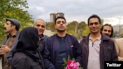 Esmail Bakhshi (C) with his family and friends after his release on bail. October 30, 2019.