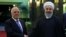 Iranian President Hassan Rohani (right) meets with Iraqi Prime Minister Haidar al-Abadi in Tehran on October 26.