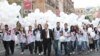 Armenia - A senior member of the ruling Republican Party escorts young party activists to an election campaign rally in Yerevan's Republic Square, 4May2012.