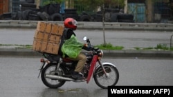 Motorbikes and scooters are very popular in Kabul.