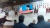 Customers at an Iraqi tea house watch the news on TV after Iran launched a number of missiles at bases in Iraq hosting U.S.-led coalition troops, in Irbil on January 8. 