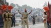 FILE:Indian Border Security Force personnel (brown) and Pakistani rangers (black) take part in the daily beating of the retreat ceremony at the India-Pakistan Wagah border crossing