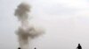 Smoke rises after Afghan Police diffused a land mine in Helmand in February.