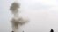 Smoke rises after Afghan Police diffused a land mine in Helmand in February.
