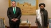 U.S. Secretary of State Mike Pompeo and Mullah Abdul Ghani Baradar, a co-founder of the Taliban and a former deputy to Mullah Omar. Baradar, who spent years in a Pakistani prison, is the Taliban’s political chief and was the head negotiator in talks with the United States.