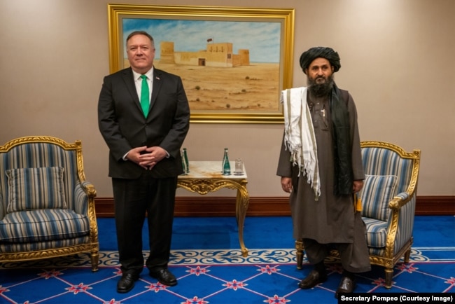 U.S. Secretary Of State Mike Pompeo and deputy Taliban leader Mullah Beradar in Qatar on September 14.