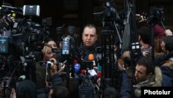Armenia - Vigen Sargsian, the Republican Party's top election candidate, speaks to reporetrs outside a polling station in Yerevan, December 9, 2018.