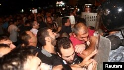 Armenia - Riot police clash with demonstrators who had gathered in a show of support for gunmen holding several hostages in a police station in Yerevan, Armenia, July 20, 2016