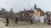 Ukrainian firefighters extinguish a blaze after Russian shelling in the eastern city of Kostyanivka on November 14. 