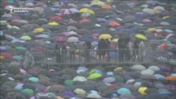 Hong Kong Protesters Gather Despite Beijing Warnings, Downpour