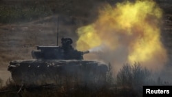 Ukrainian tank crews attend a military exercise in north Ukraine on September 8.