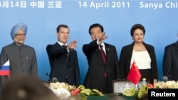 BRICS leaders: India's Prime Minister Manmohan Singh, Russia's President Dmitry Medvedev, China's President Hu Jintao, and Brazil's President Dilma Rousseff arrive for a joint news conference at the BRICS Leaders Meeting in Sanya on April 14.