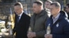 Hungarian Foreign Minister Peter Szijjarto (left), Andriy Yermak (center), the head of Ukraine’s presidential office, and Ukrainian Foreign Minister Dmytro Kuleba pay tribute at a monument for Ukrainian soldiers in Uzhhorod on January 29.