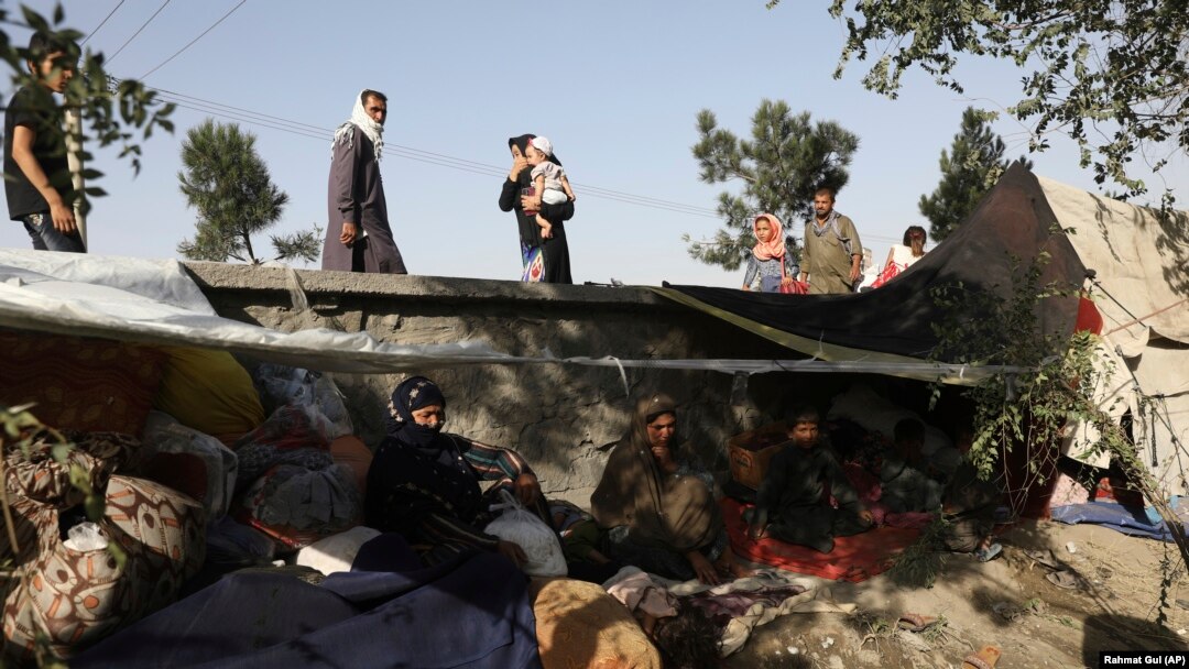 Internally displaced Afghans from northern provinces who fled fighting take refuge in a public park in Kabul on August 13.