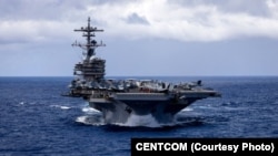 The USS George HW Bush aircraft carrier sailing in the Indian Ocean.