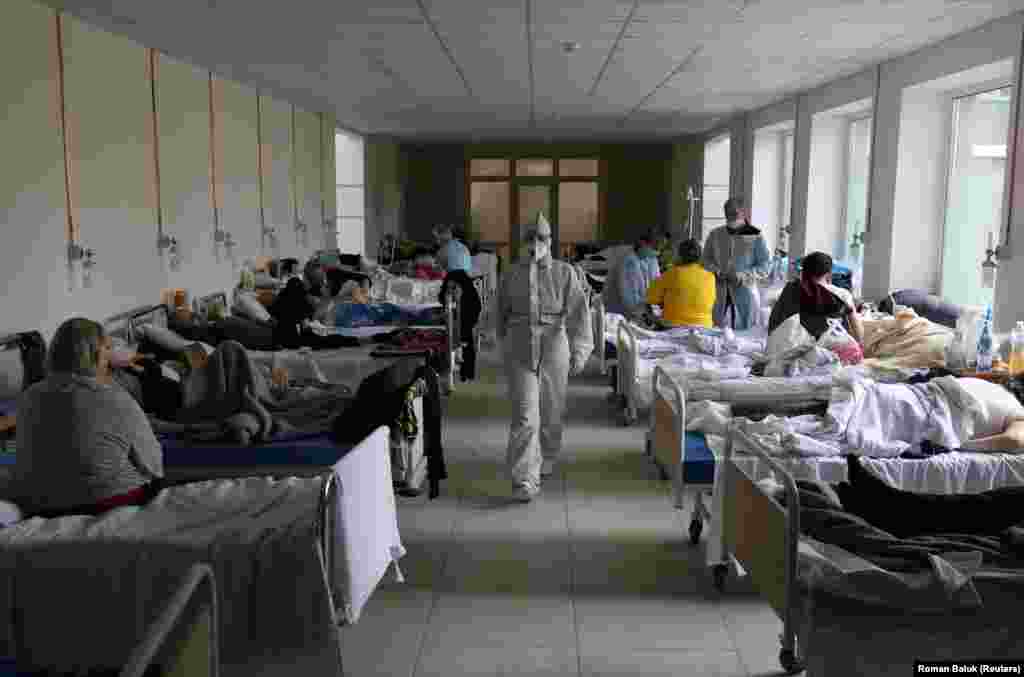 A medical specialist wearing personal protective equipment walks in the medical college building of a local hospital in Lviv, Ukraine, that was converted into a coronavirus ward. (Reuters/Roman Baluk)