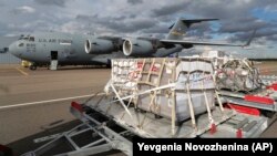 A shipment containing medical aid from the United States, including 50 ventilators, is unloaded from a U.S. Air Force C-17 transport plane at Vnukovo International Airport in Moscow on May 21.