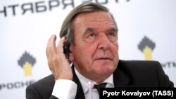 Gerhard Schroeder talks to the media after being made chairman of the board of Russian state-owned oil giant Rosneft, in St. Petersburg on September 29.