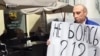 WATCH: Man Behind Putin Mask Protest Seeks Asylum in Ukraine
