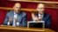 Ukrainian Prime Minister Arseniy Yatsenyuk (right) and Energy Minister Yuriy Prodan during a session in parliament on August 14 which passed laws allowing sanctions to be imposed on Russia. 