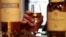 U.K. -- A man holds a glass of whisky in the visitors centre of the Diageo-owned Dalwhinnie Distillery in Dalwhinnie in the Scottish Highlands May 16, 2011. 