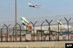 An Emirates aircraft takes off from Dubai International Airport on March 8.