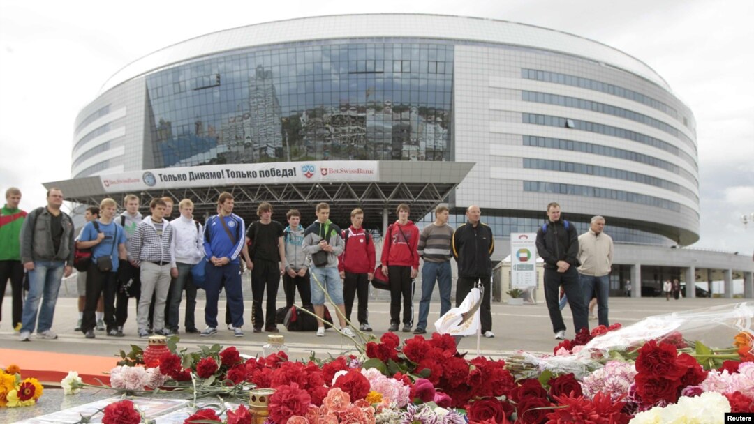 Mourners place flowers at the hockey arena in Minsk that was to have been the site of the team's season-opening game on September 9.