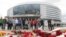 Mourners place flowers at the hockey arena in Minsk that was to have been the site of the team's season-opening game on September 9.