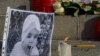 Armenia - A photographs of 6-month-old Seryozha Avetisian (L) is displayed during a candlelight vigil in Yerevan, 20Jan2015.