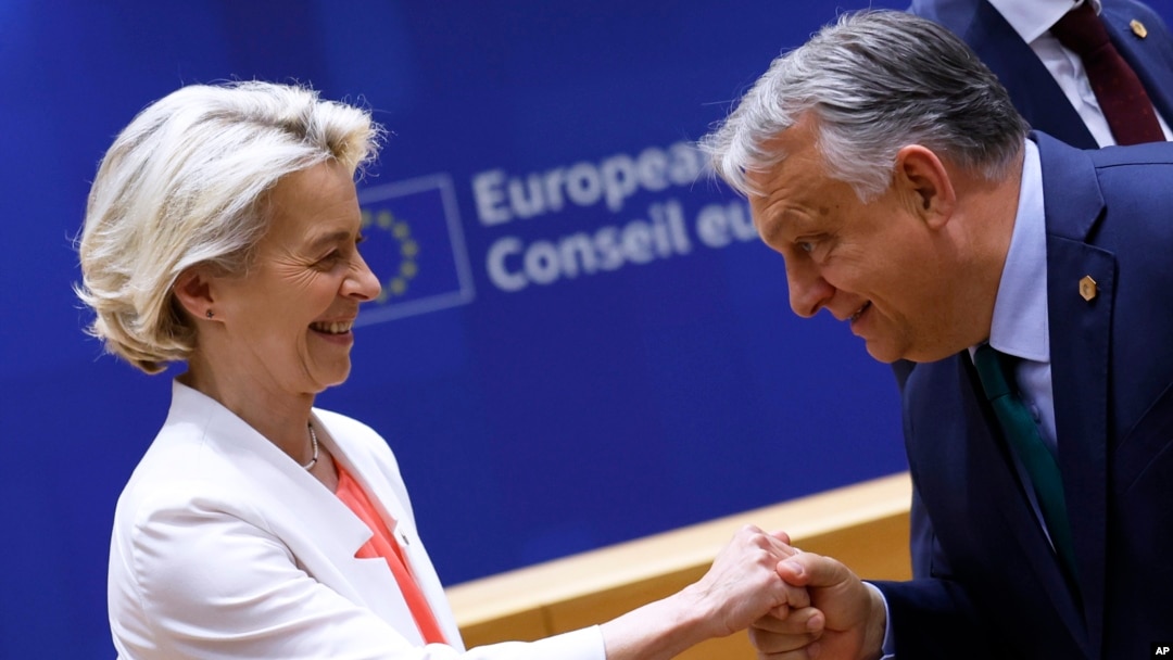 European Commission President Ursula von der Leyen (left) is greeted by Hungarian Prime Minister Viktor Orban during a meeting at the EU summit in Brussels on June 17.