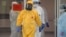 Russian President Vladimir Putin, wearing protective gear, at a hospital for patients infected with the coronavirus on the outskirts of Moscow on March 24.