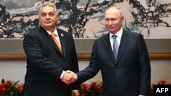 Russian President Vladimir Putin meets with Hungarian Prime Minister Viktor Orban in Beijing on October 17. 