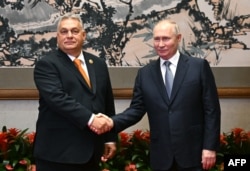 Похожие, но разные: Виктор Орбан и Владимир Путин во время их последней встречи в кулуарах экономического форума в Китае в октябре 2023 года
