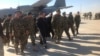 Abdul Jabbar Qahraman surrounded by senior officers of the Afghan army.